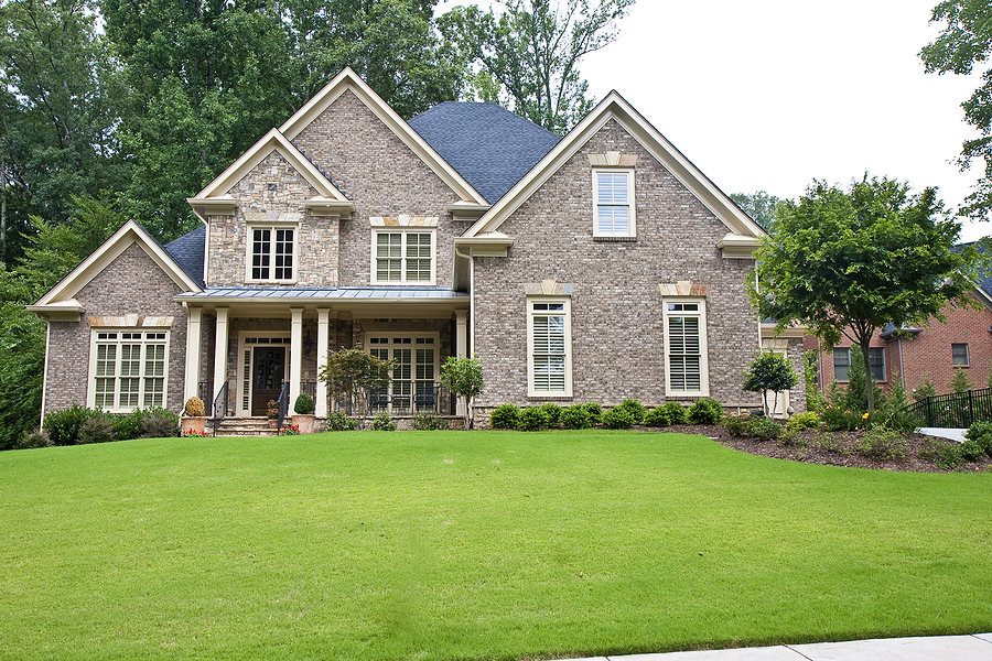 Brick House with Liquid Aeration applied to the lawn near Cottleville MO
